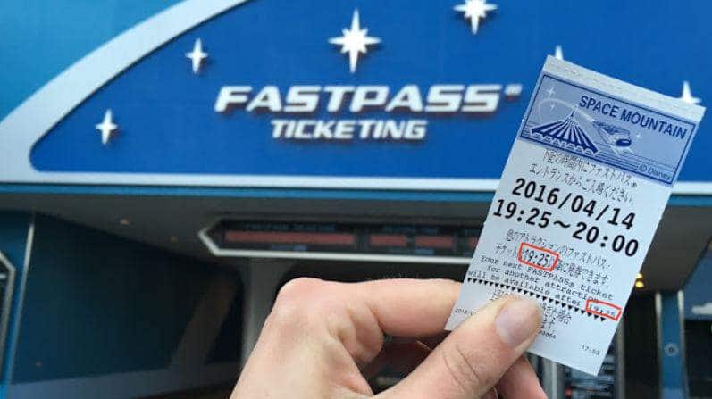 Holding up a FastPass ticket