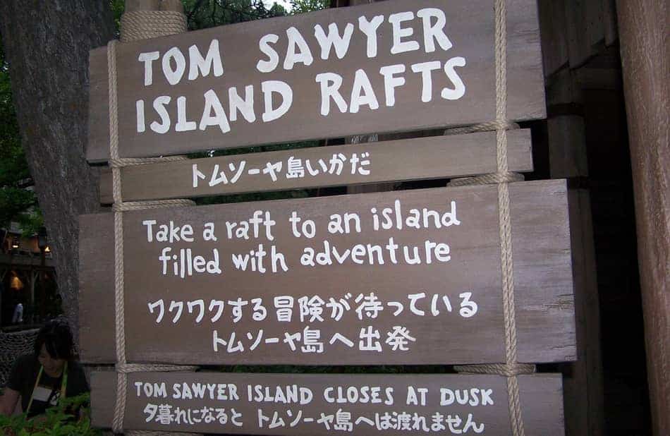 Sign for the Tom Sawyer Island Rafts showing English and Japanese