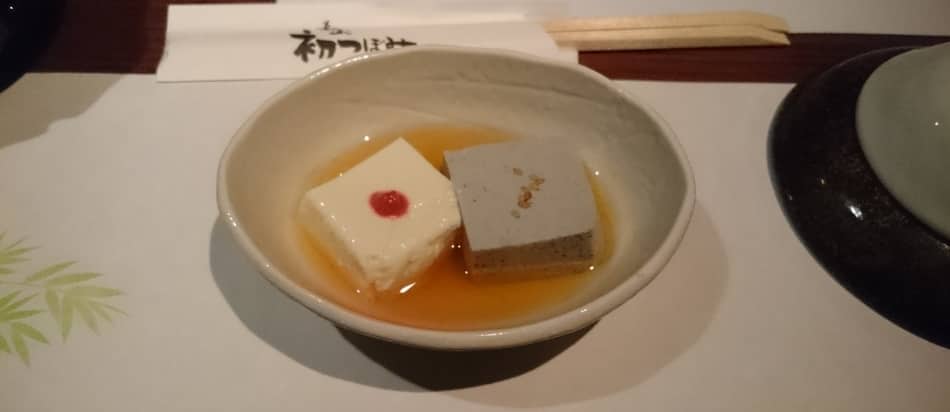 Table charge in Japan. To cubes of cold tofu served in a bowl.