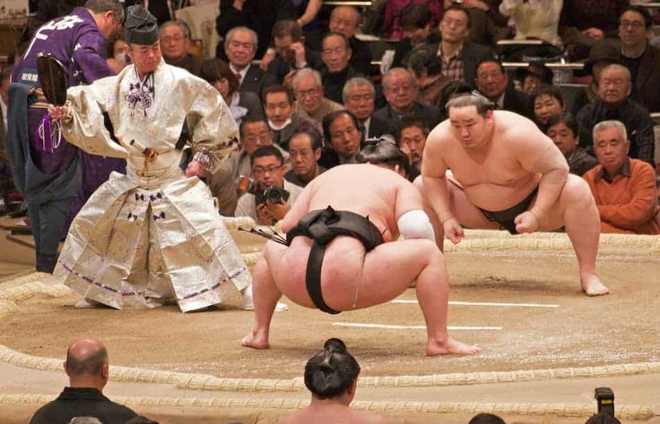 Two sumo wrestlers about to start wrestling
